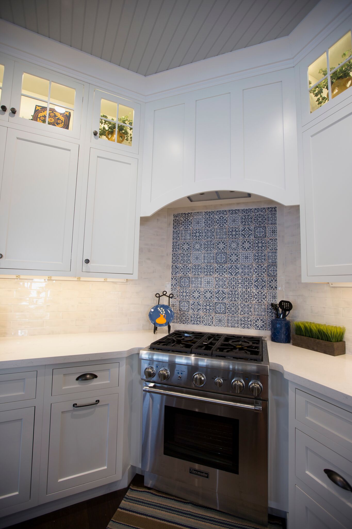 Modern kitchen corner featuring a stainless steel gas stove