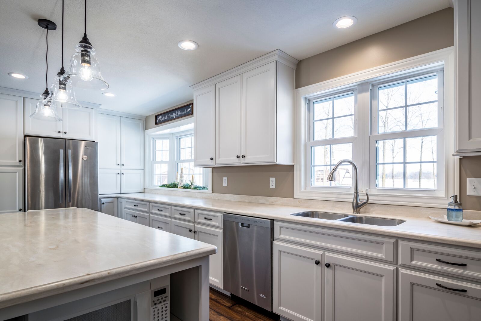 Modern kitchen featuring white cabinetry